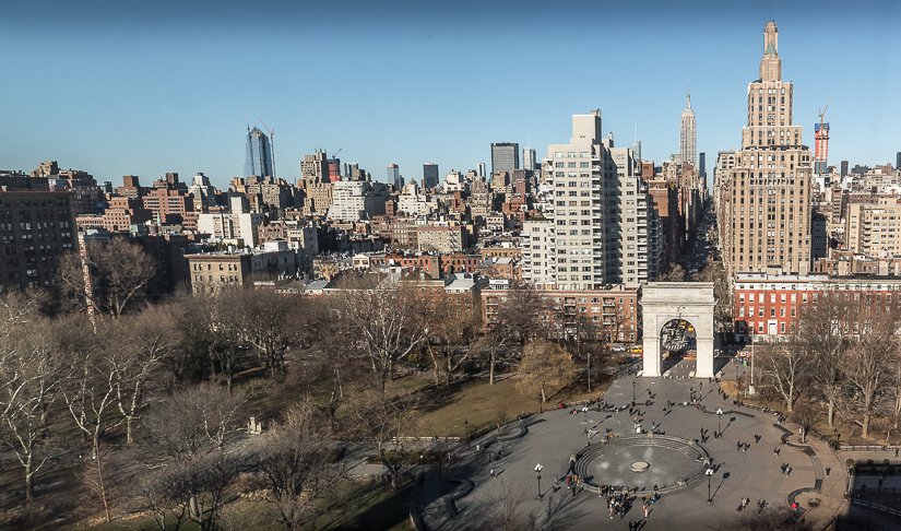 Washington Square Park from above showing trees and NYU campus skyline